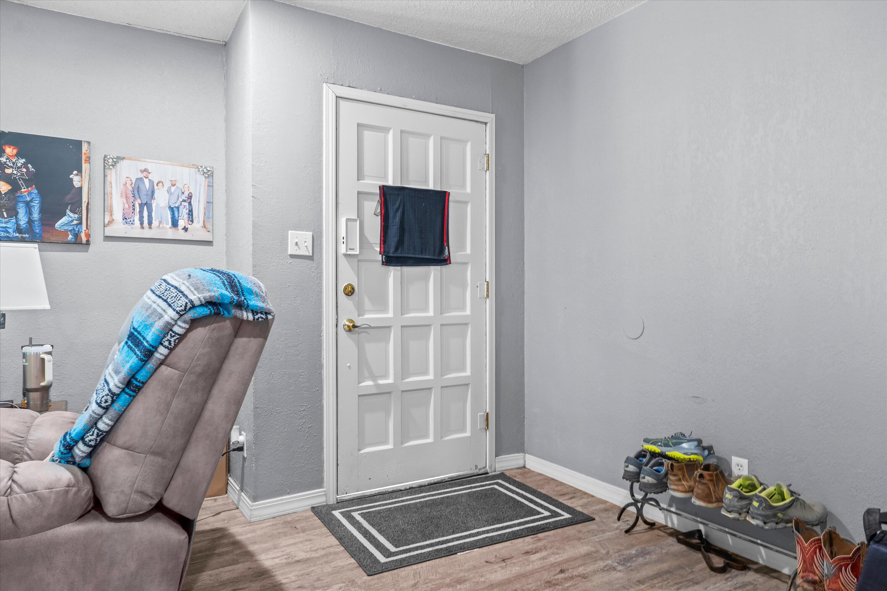 102 3rd Street Plains, TX 79355 - Photo 4 of 27 a living room with furniture and a flat screen tv