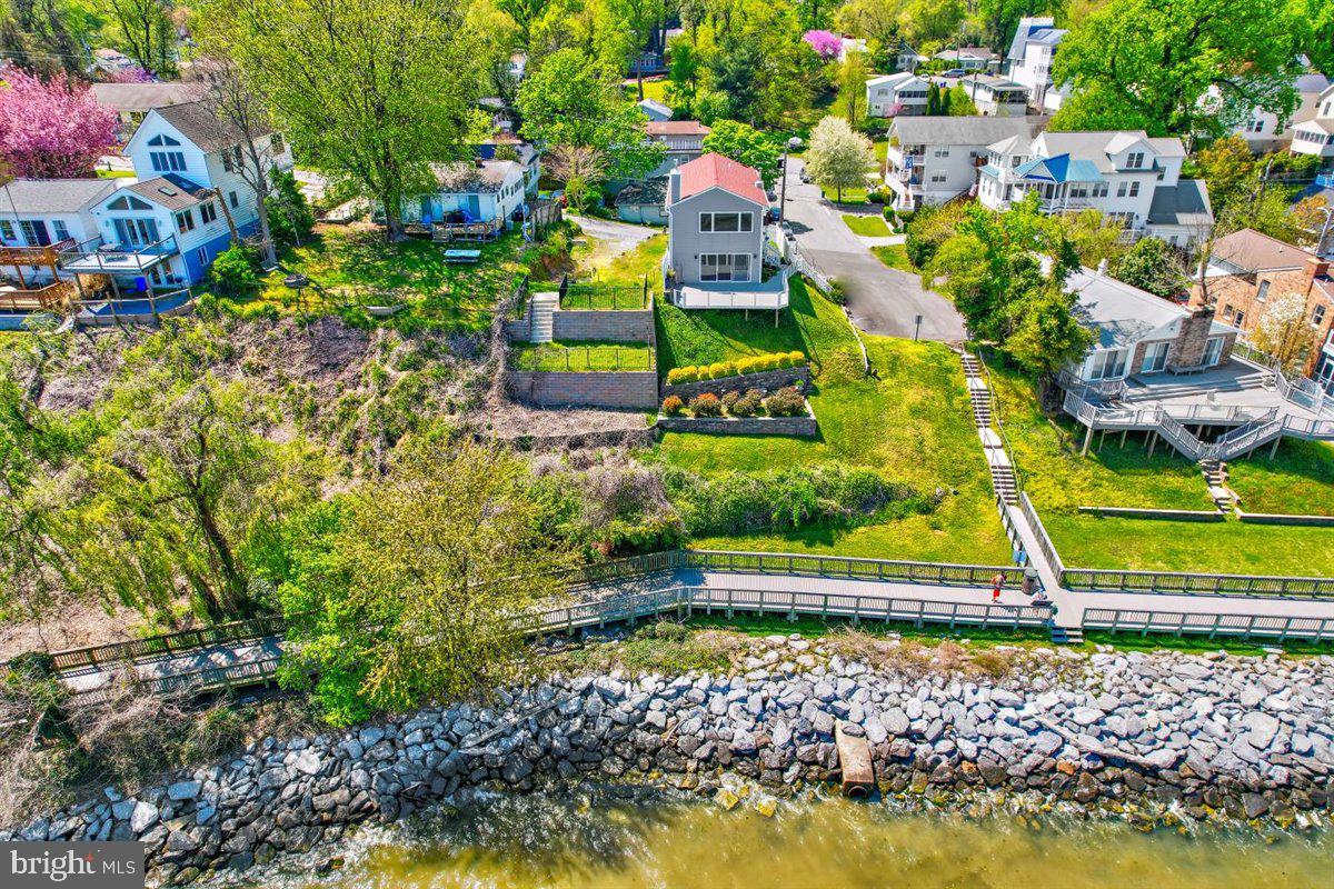 7517 B Street Chesapeake Beach, MD 20732 - Photo 11 of 78 a view of a swimming pool with a yard and plants