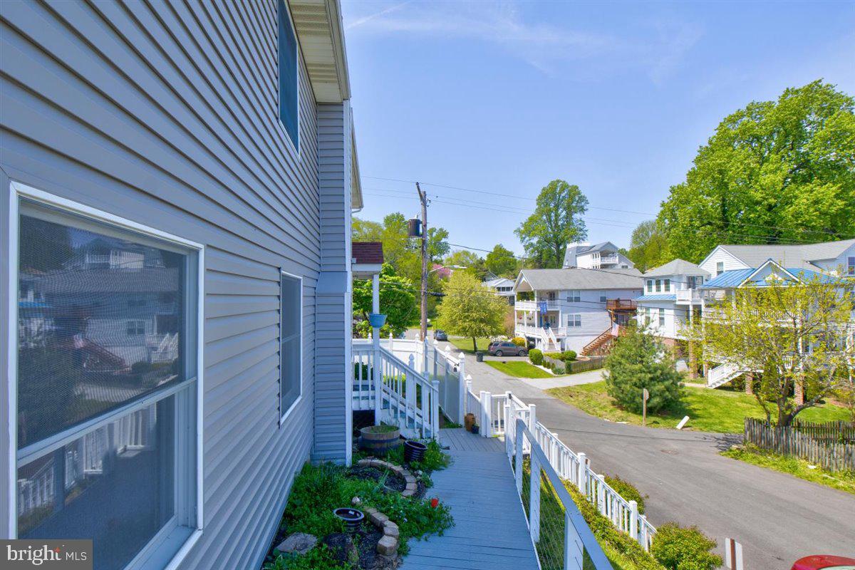 7517 B Street Chesapeake Beach, MD 20732 - Photo 22 of 78 a view of a house with a yard and potted plants