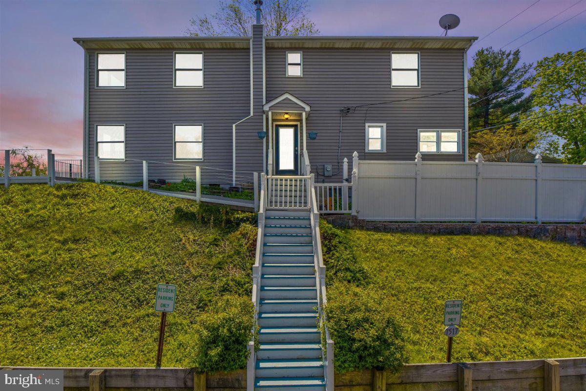 7517 B Street Chesapeake Beach, MD 20732 - Photo 26 of 78 a front view of a house with a yard