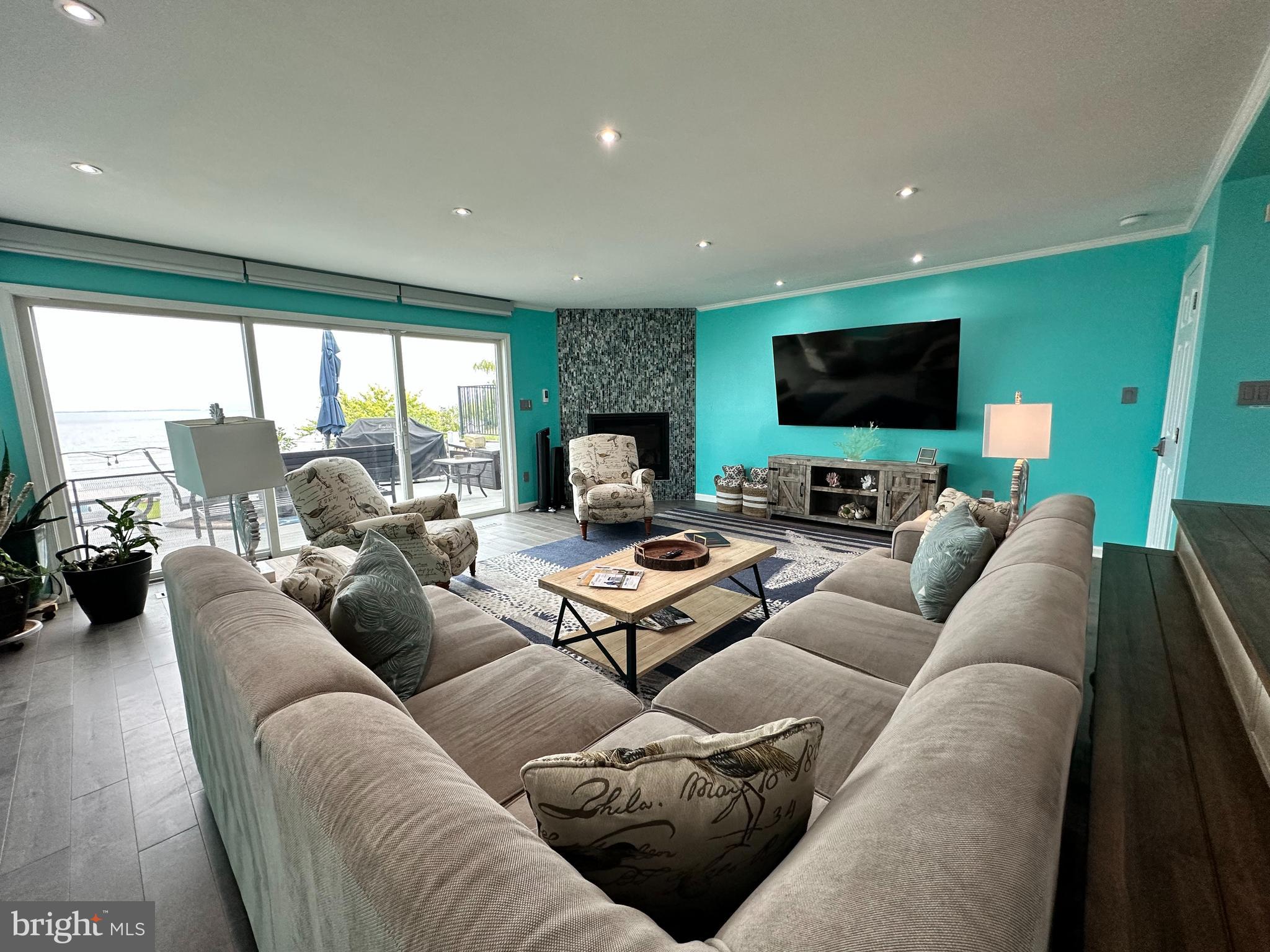 7517 B Street Chesapeake Beach, MD 20732 - Photo 35 of 78 a living room with furniture and a flat screen tv