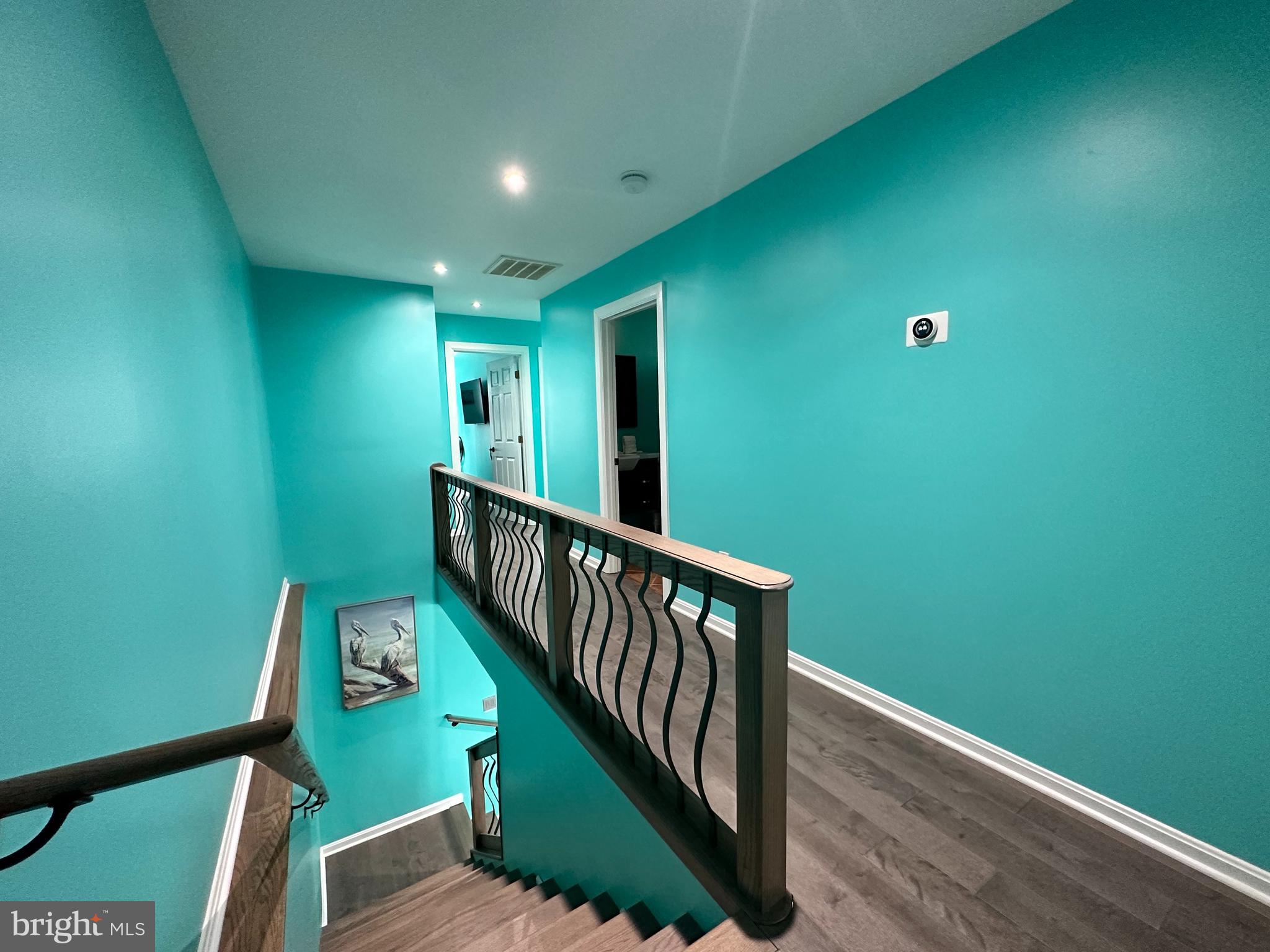 7517 B Street Chesapeake Beach, MD 20732 - Photo 66 of 78 a view of a hallway with wooden floor