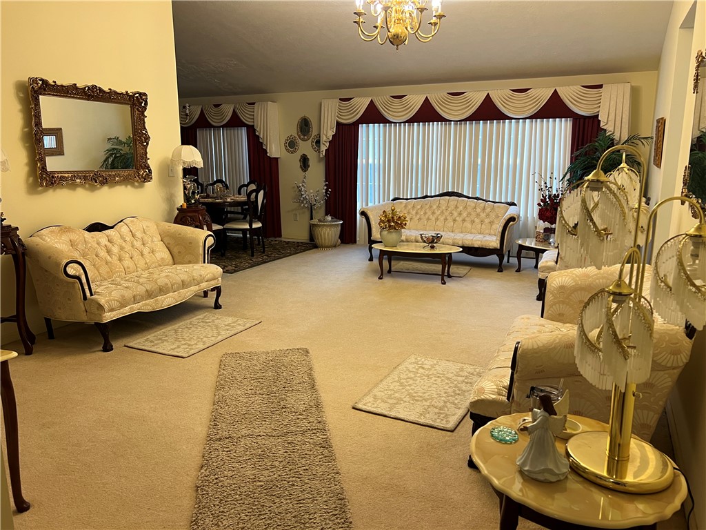 521 Calhoun Shores Parkway Calhoun Falls, SC 29628 - Photo 3 of 39 This inviting living room with plush carpet flooring offers ample space for relaxation and entertaining.