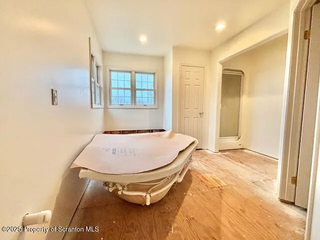 a view of an empty room with windows