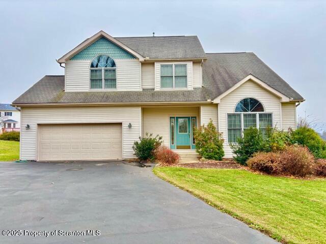 400 Fairview Road Clarks Green, PA 18411 - Photo 29 of 32 a front view of a house with a yard and garage