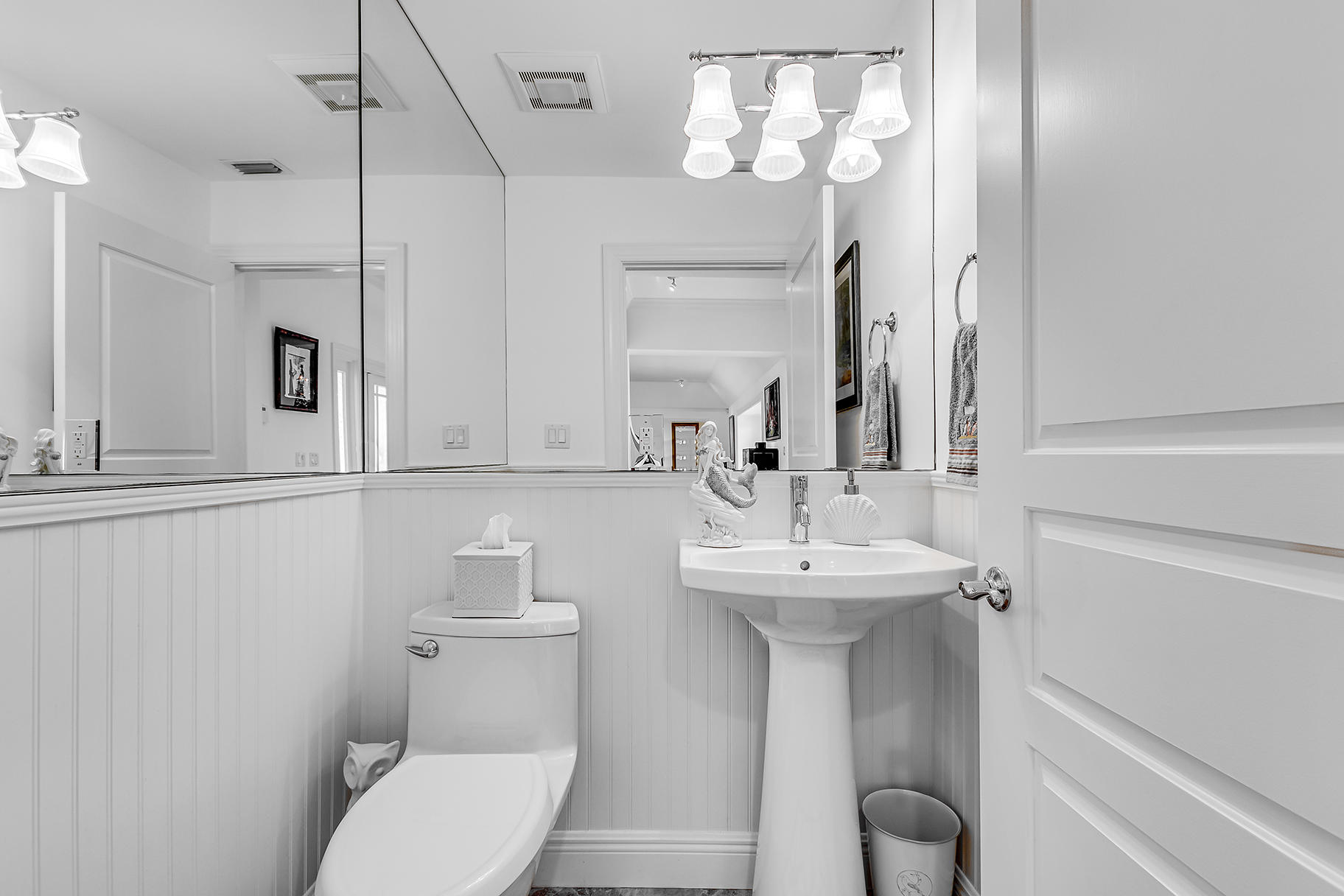 75 River Drive Tequesta, FL 33469 - Photo 41 of 42 a bathroom with a toilet sink and mirror