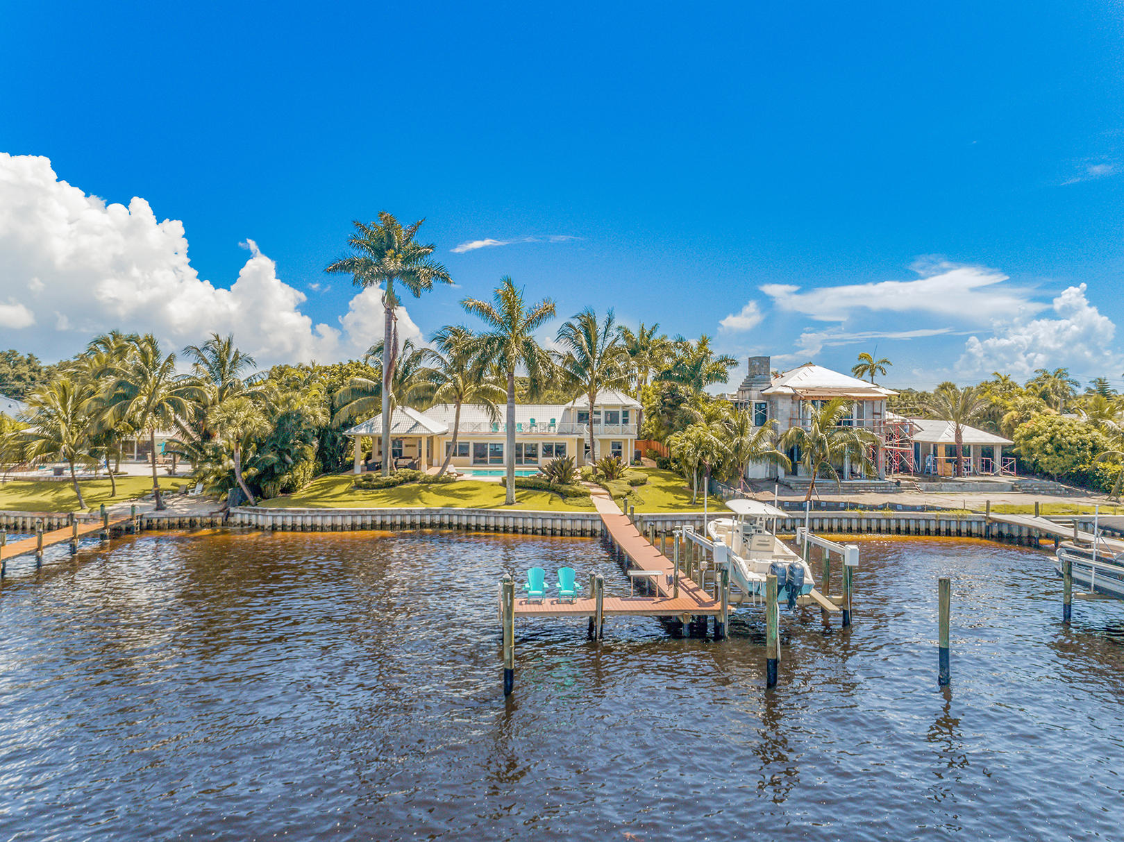 75 River Drive Tequesta, FL 33469 - Photo 7 of 42 a view of swimming pool with outdoor seating and plants