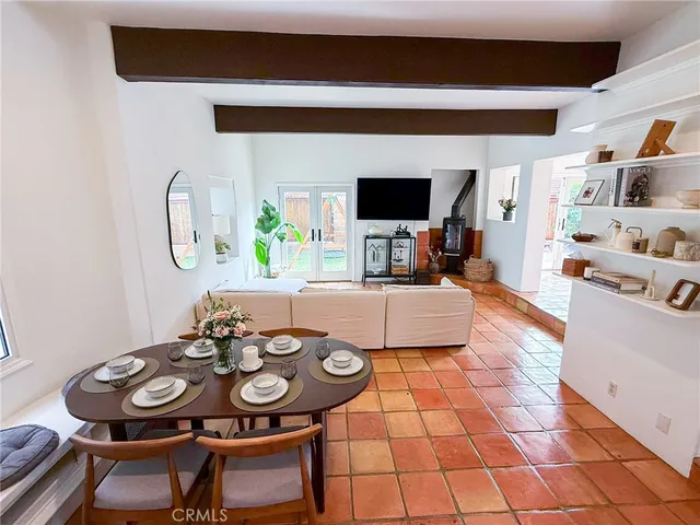 a living room filled with furniture and a flat screen tv