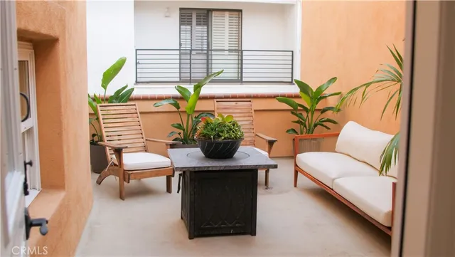 a blue kitchen with a refrigerator and cabinets