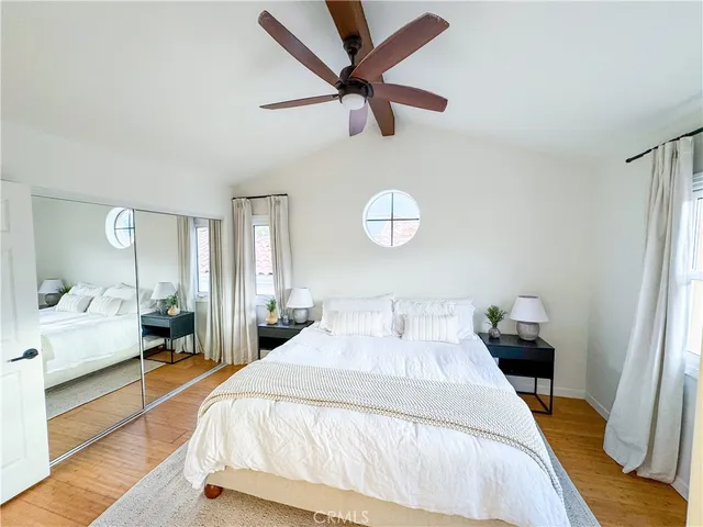 a bedroom with bed and a window