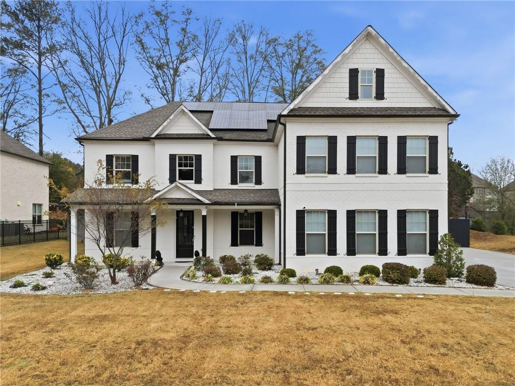 a front view of a house with a yard