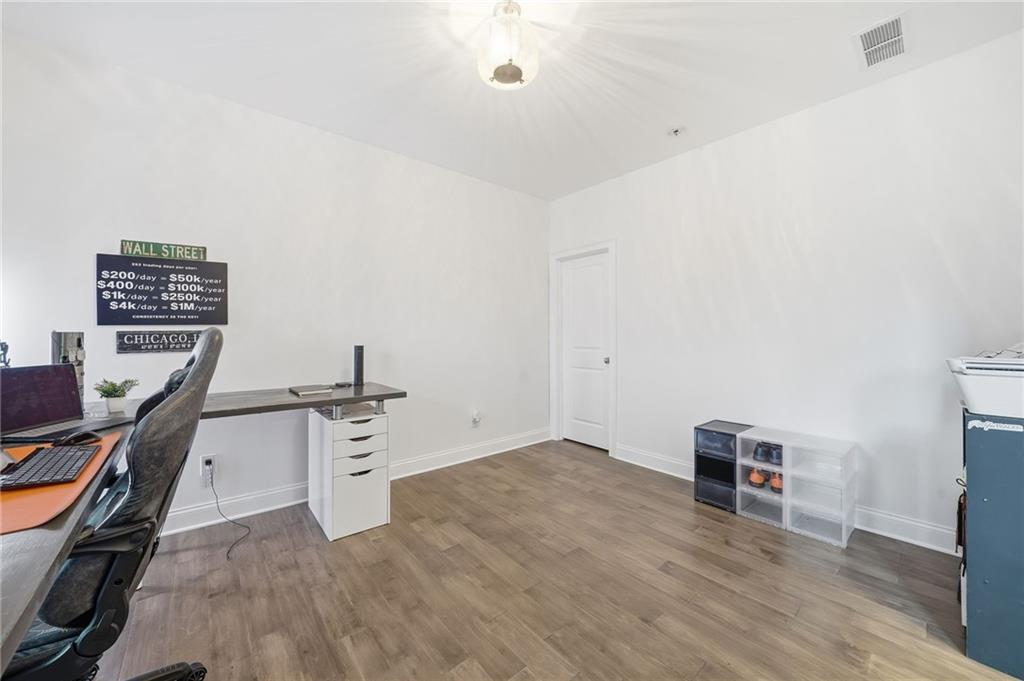 5115 Five Forks Trickum Road Southwest Lilburn, GA 30047 - Photo 26 of 63 a view of a workspace with furniture