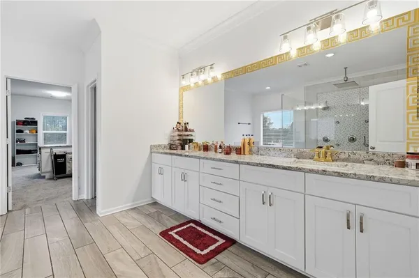 a bedroom with a large bed and a dresser