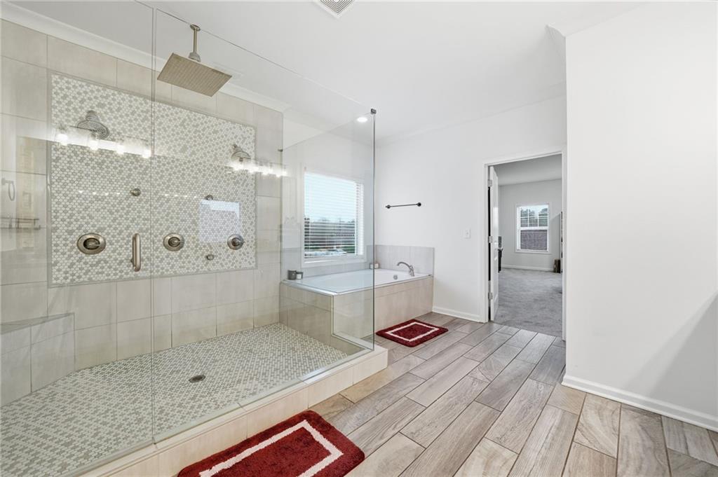 5115 Five Forks Trickum Road Southwest Lilburn, GA 30047 - Photo 33 of 63 a bathroom with a shower