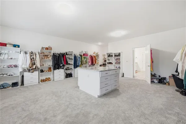 a bedroom with a bed and flat screen tv