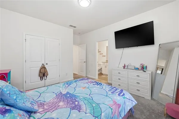 a view of a house with swimming pool and sitting area