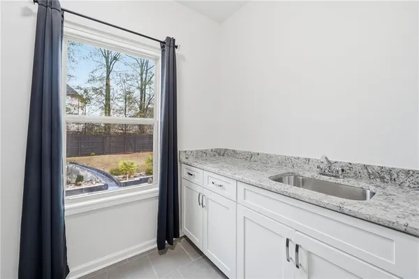 a view of swimming pool with lounge chair