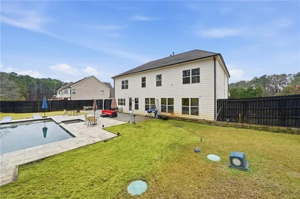 an aerial view of residential house with outdoor space