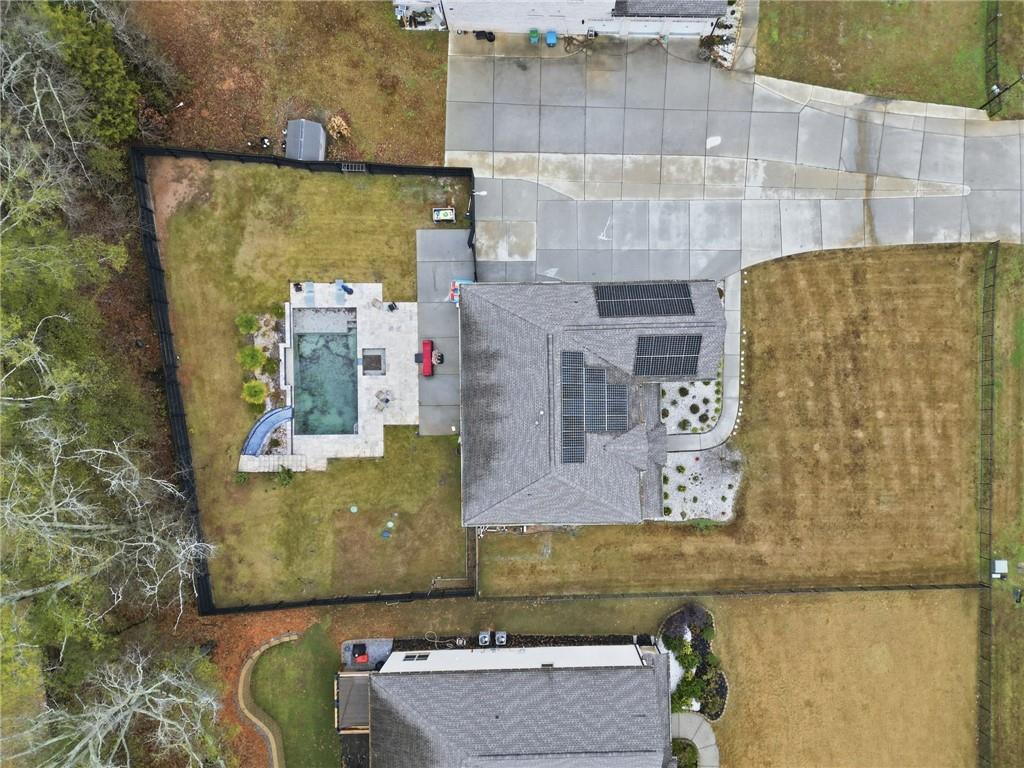 5115 Five Forks Trickum Road Southwest Lilburn, GA 30047 - Photo 59 of 63 an aerial view of residential house with outdoor space