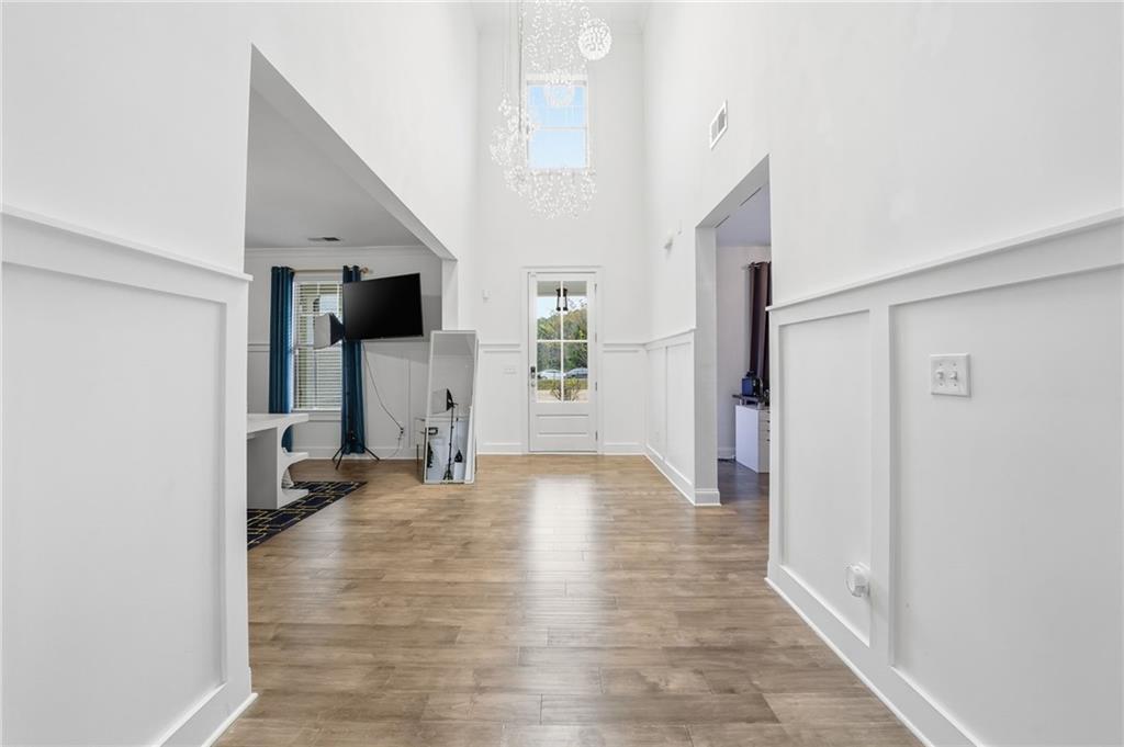 5115 Five Forks Trickum Road Southwest Lilburn, GA 30047 - Photo 6 of 63 a view of a big room with closet and windows
