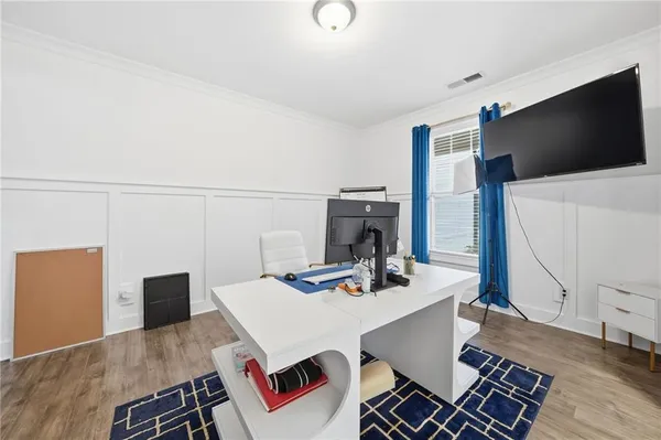 a living room with furniture fireplace and flat screen tv