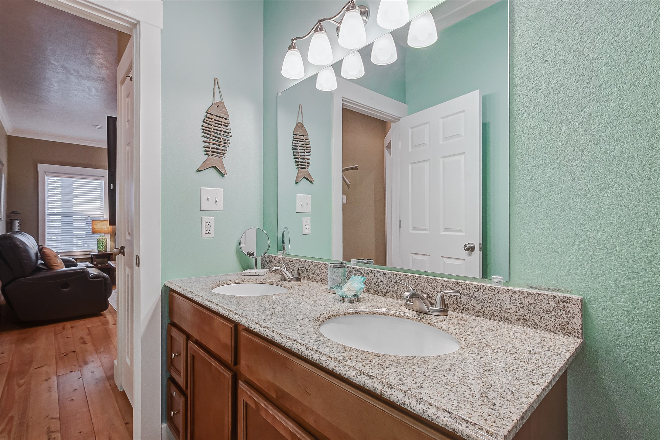 935 Westview Crystal Beach, TX 77650 - Photo 27 of 38 a bathroom with a granite countertop sink and a mirror