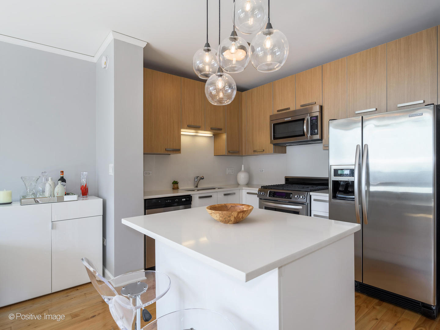 Undisclosed Address Chicago, IL 60601 - Photo 4 of 25 a kitchen with a sink a stove and cabinets