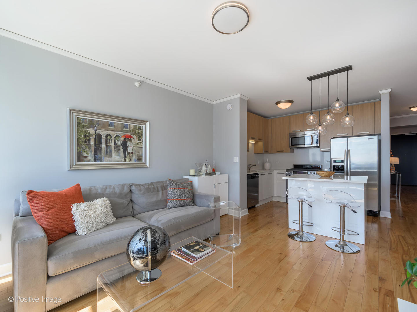 Undisclosed Address Chicago, IL 60601 - Photo 5 of 25 a living room with furniture kitchen view and a wooden floor