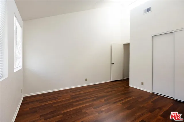 an empty room with wooden floor