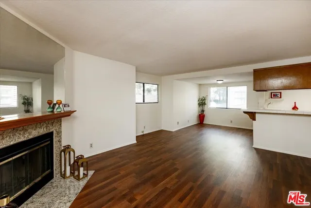 a view of a livingroom with furniture and a fireplace