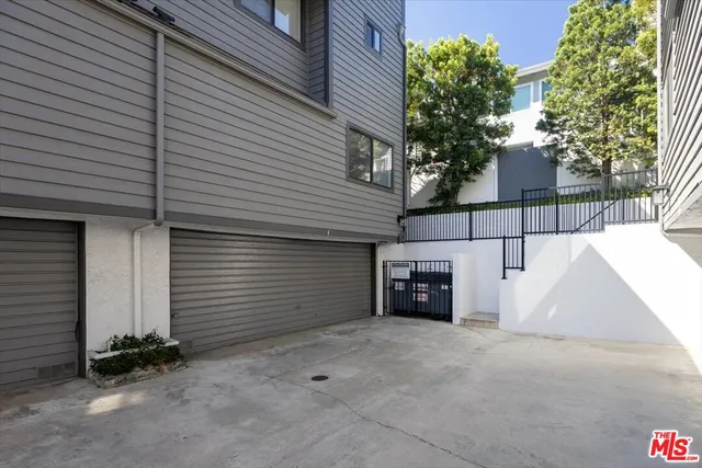 a view of a house with a yard and garage