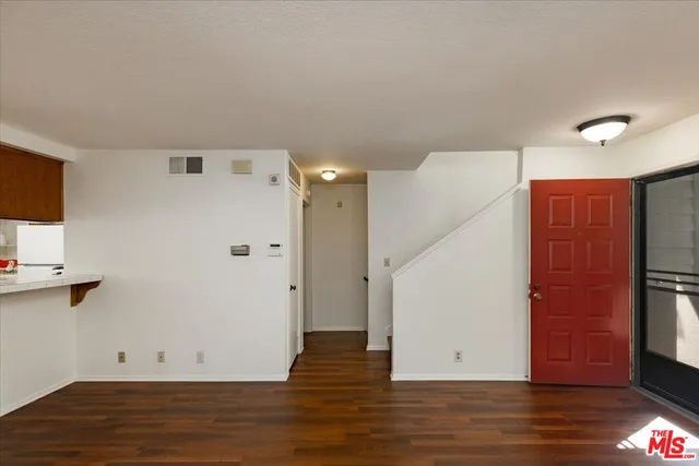 a view of room with wooden floor and window