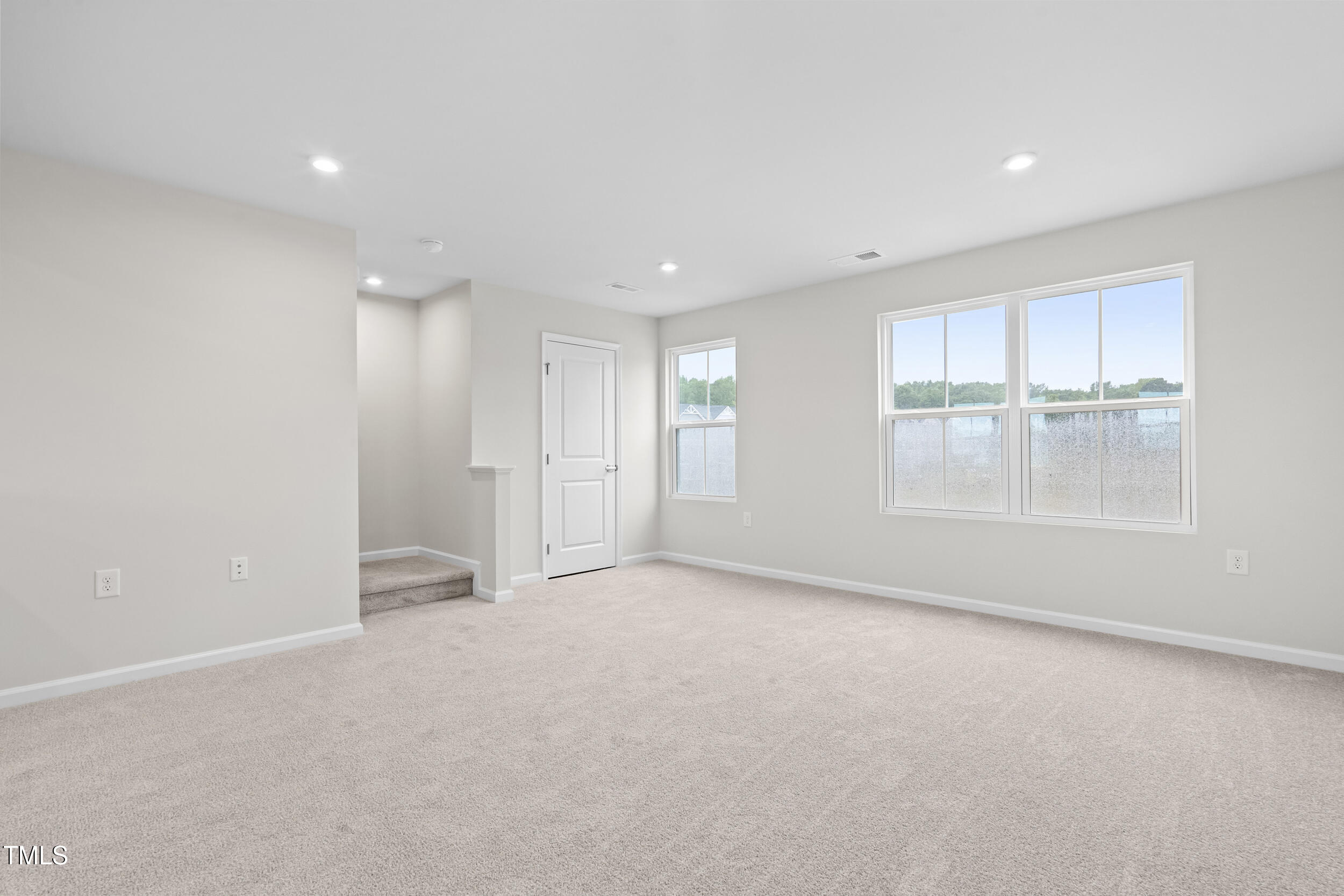 161 Sunny Acrs Road Raleigh, NC 27603 - Photo 12 of 27 an empty room with windows and closet