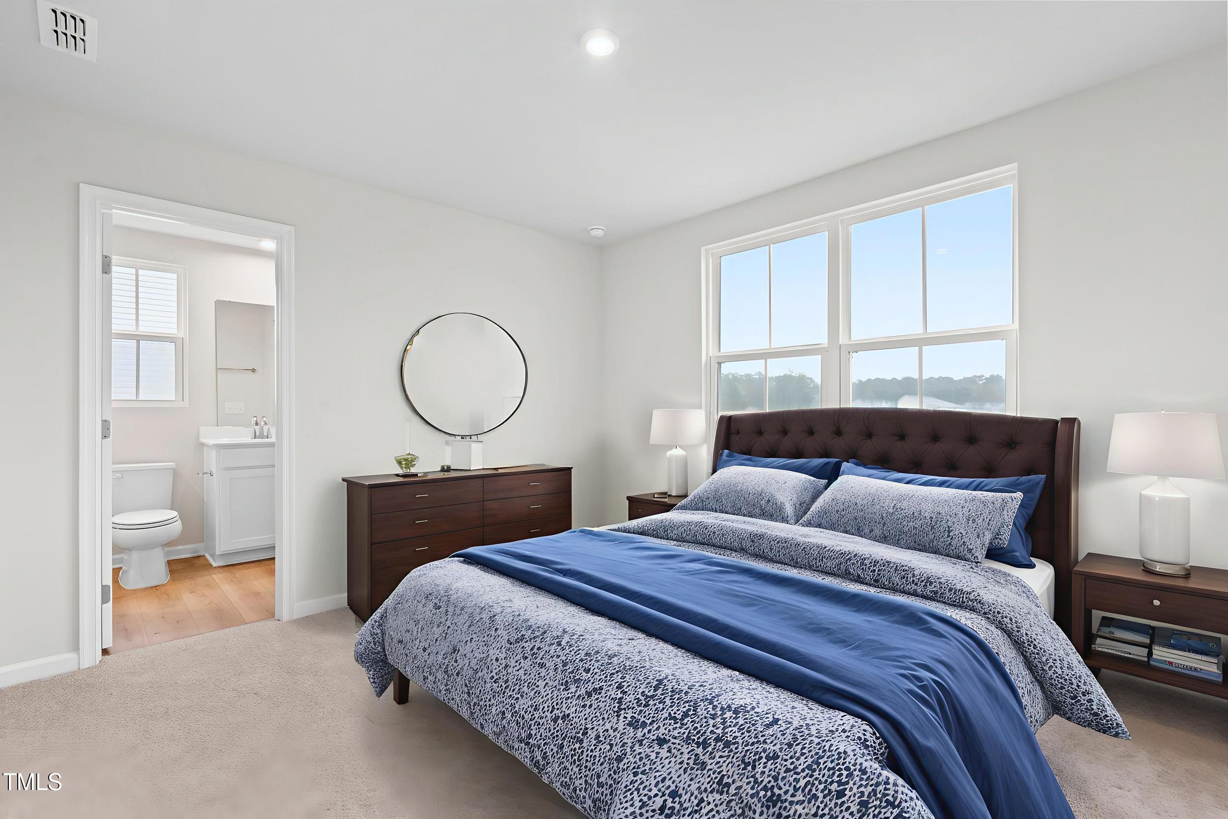 161 Sunny Acrs Road Raleigh, NC 27603 - Photo 17 of 27 a bedroom with bed and a window