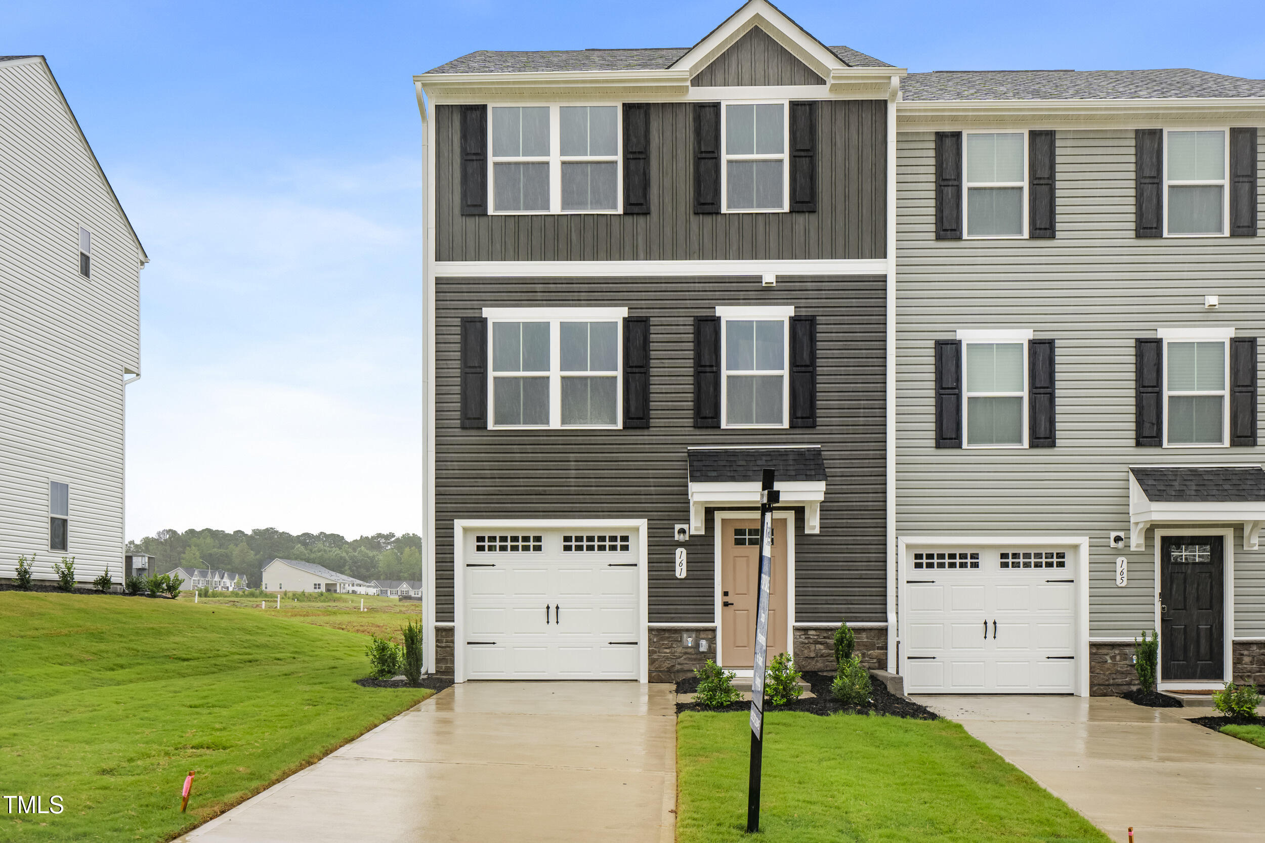 161 Sunny Acrs Road Raleigh, NC 27603 - Photo 2 of 27 a front view of a house with a yard