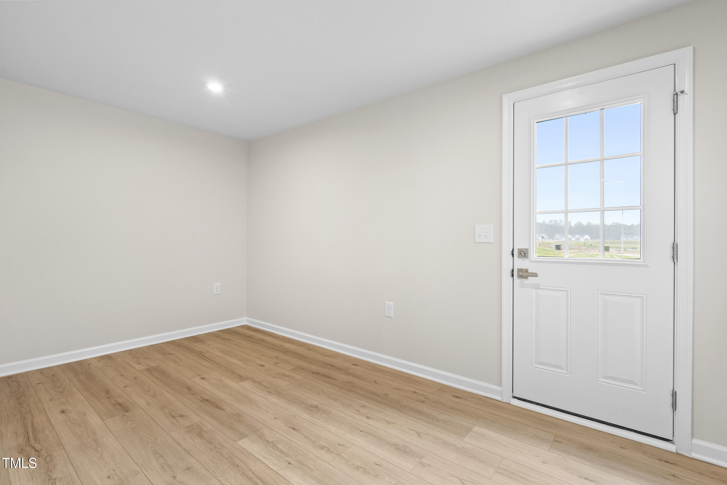 161 Sunny Acrs Road Raleigh, NC 27603 - Photo 10 of 27 an empty room with wooden floor and windows