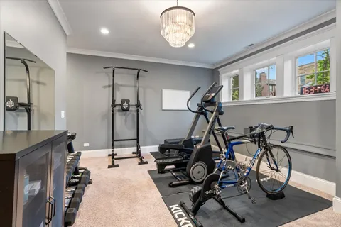 a living room with furniture a flat screen tv and a large window