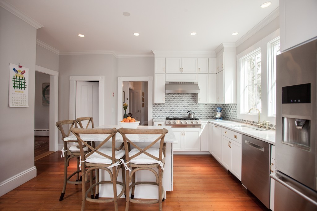 41 Forest Street Wellesley, MA 02481 - Photo 8 of 23 a kitchen with stainless steel appliances kitchen island granite countertop a sink and cabinets