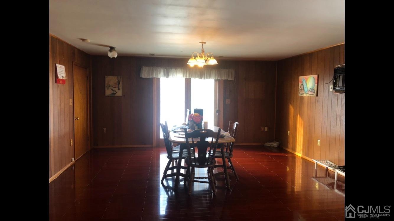 22 Stevens Road Edison, NJ 08817 - Photo 2 of 8 a view of a dining room with furniture window and wooden floor