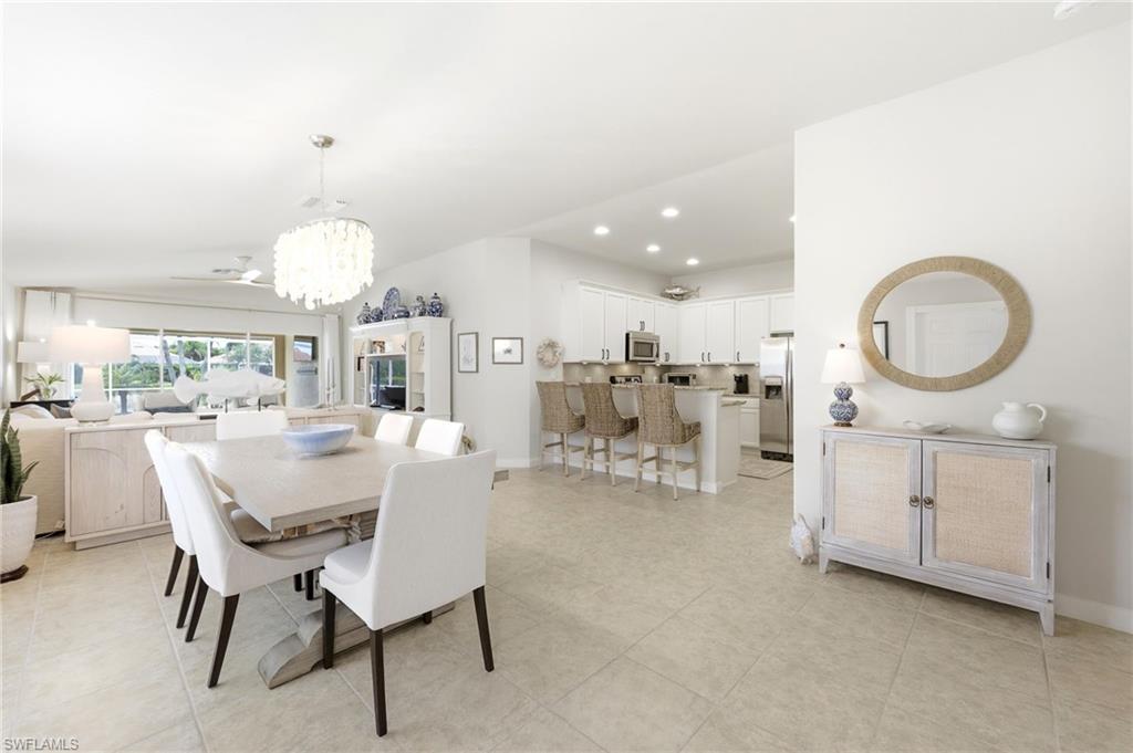8658 Genova Court Naples, FL 34114 - Photo 14 of 49 Dining Area and open Kitchen