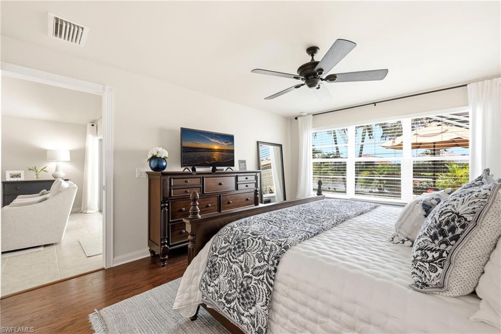 8658 Genova Court Naples, FL 34114 - Photo 15 of 49 Master Bedroom facing Pool/Lake