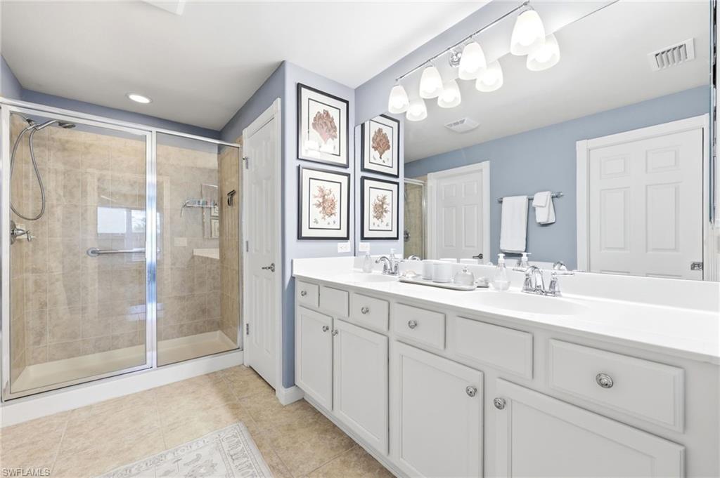 8658 Genova Court Naples, FL 34114 - Photo 19 of 49 Master Bathoom with dual sinks
