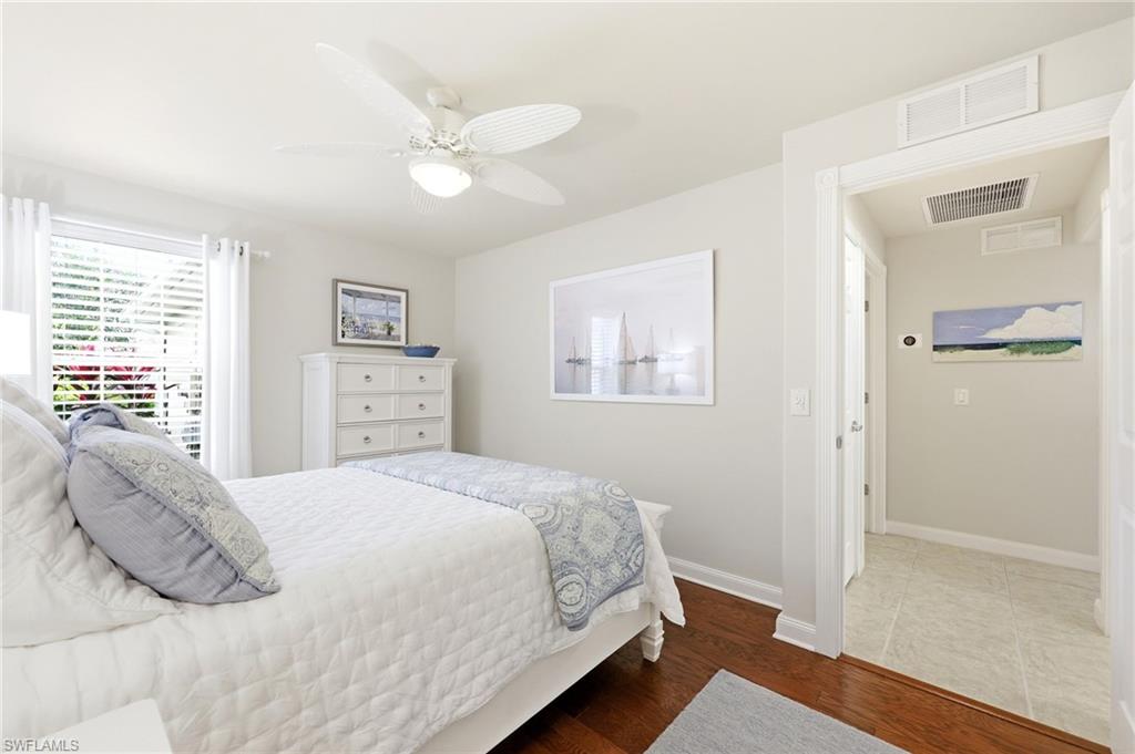8658 Genova Court Naples, FL 34114 - Photo 21 of 49 Guest Bedroom with Wood Flooring