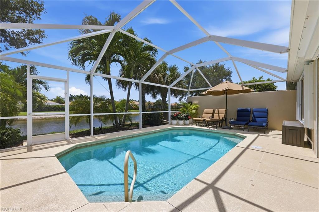 8658 Genova Court Naples, FL 34114 - Photo 28 of 49 Screened-in Pool desck with privacy wall