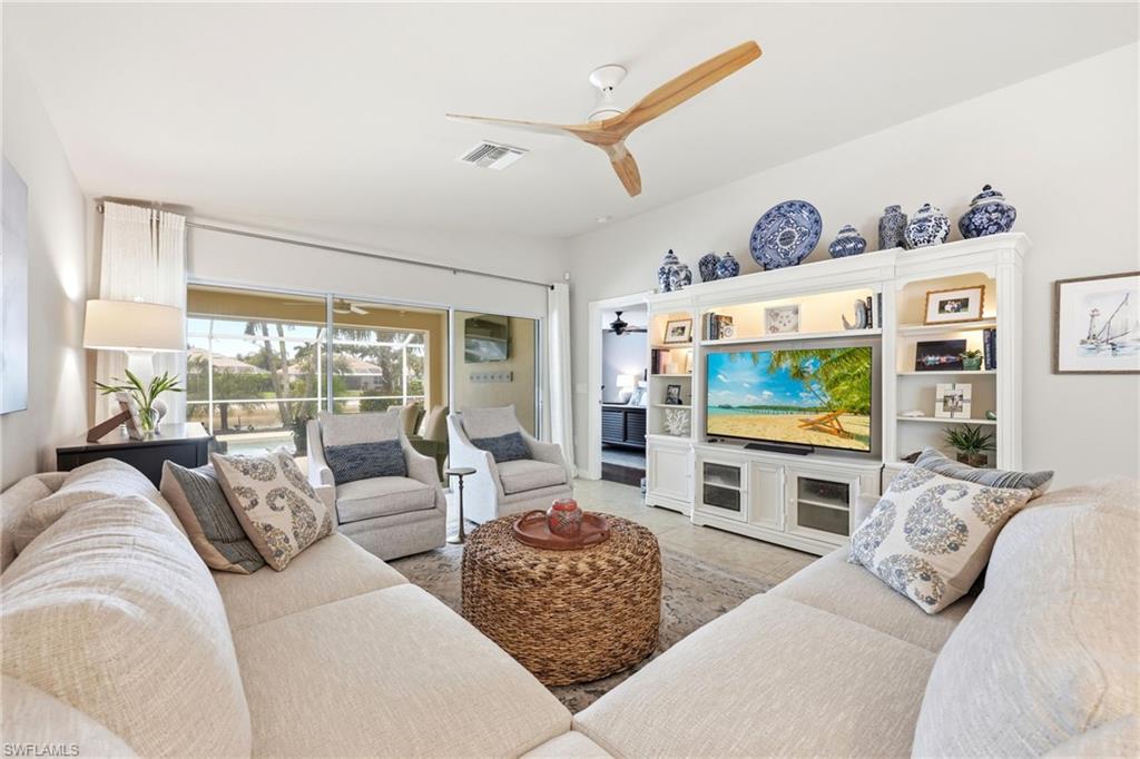 8658 Genova Court Naples, FL 34114 - Photo 7 of 49 Living Room with access to Patio, Pool and Master Bedroom