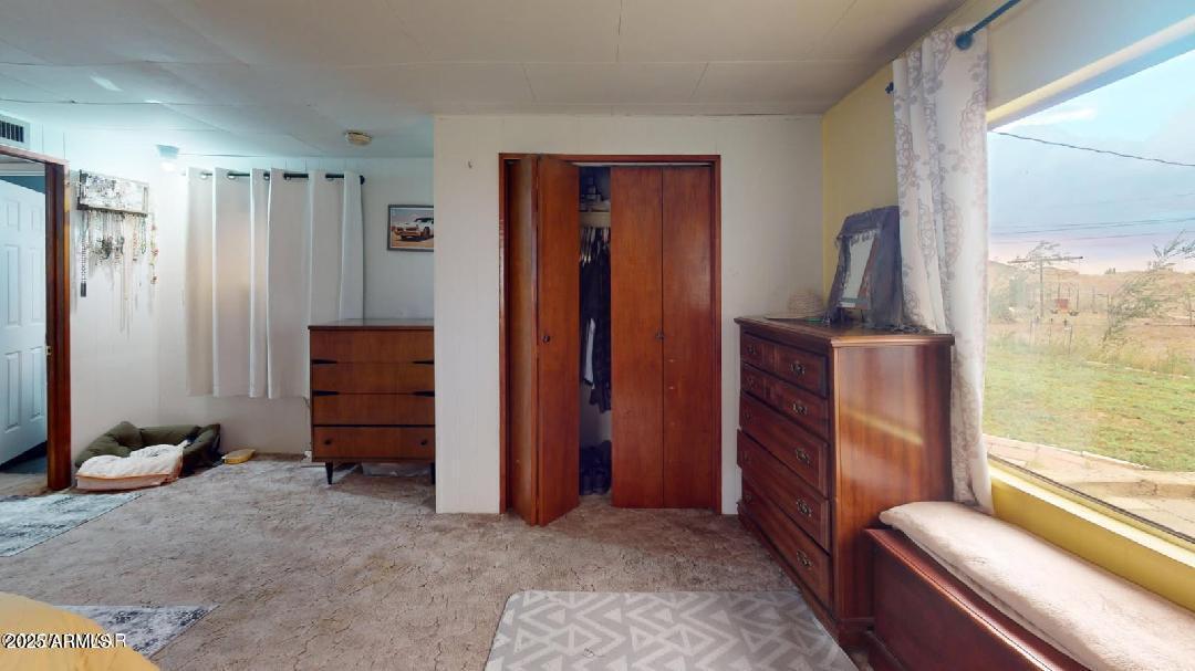1110 Ranch Road Taylor, AZ 85939 - Photo 16 of 19 a view of room with furniture and a window