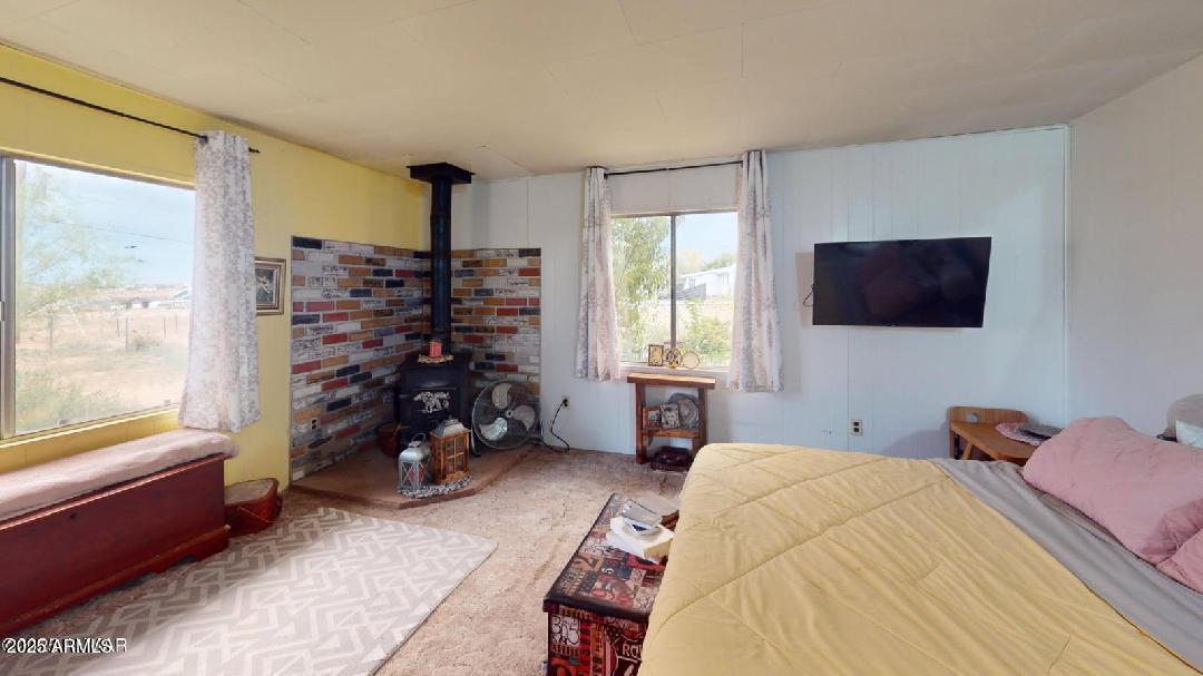 1110 Ranch Road Taylor, AZ 85939 - Photo 17 of 19 a bed room with a bed and a window