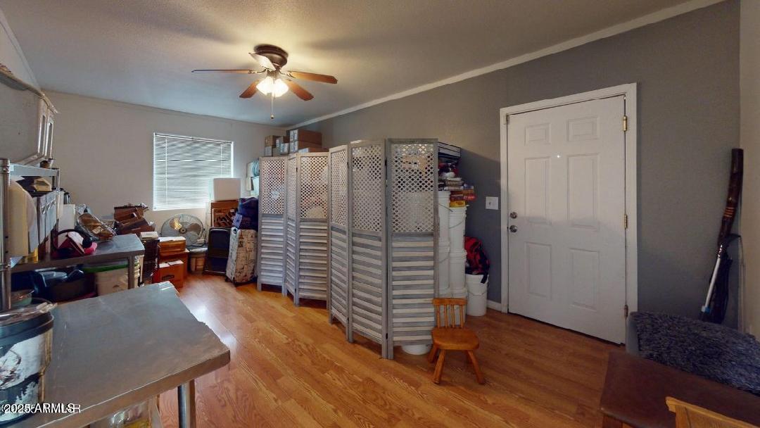 1110 Ranch Road Taylor, AZ 85939 - Photo 19 of 19 a view of a livingroom with furniture hardwood floor and a ceiling fan