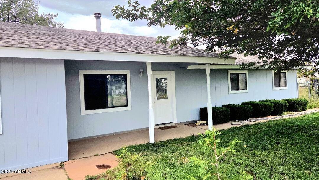 1110 Ranch Road Taylor, AZ 85939 - Photo 2 of 19 a front view of a house with a yard