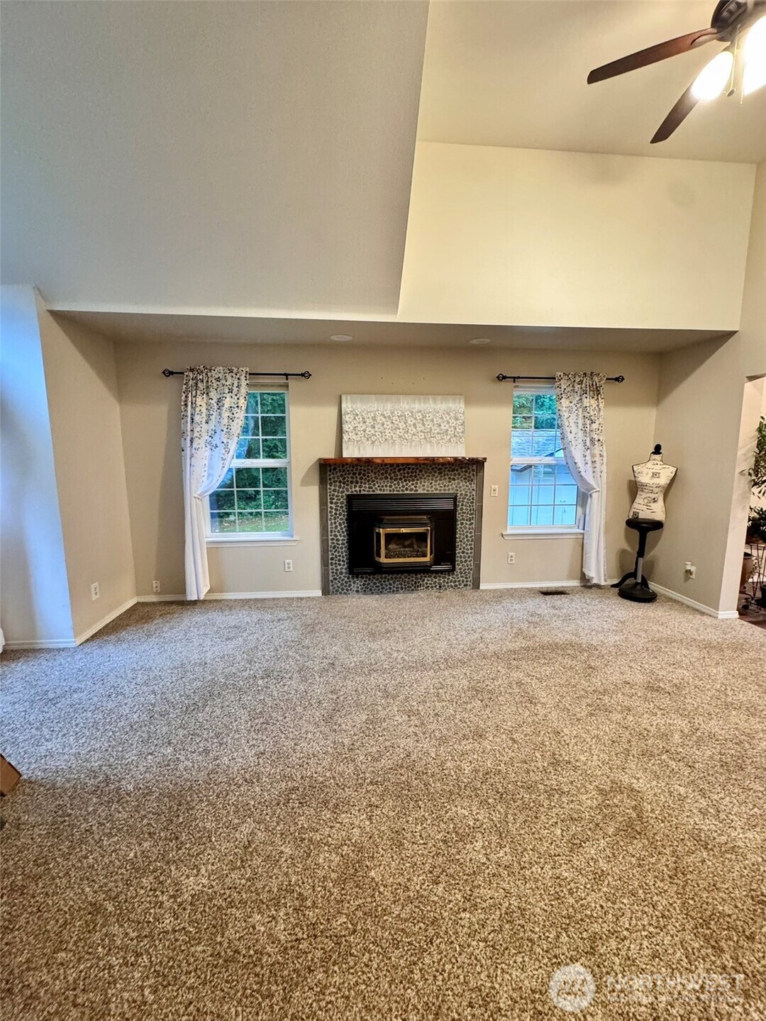 14444 Crescent Valley Road Southeast Olalla, WA 98359 - Photo 11 of 31 a view of empty room with a fireplace